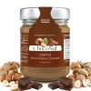 Jar of Choconut Cream with gianduja flavour, around hazelnuts and chocolate squares.