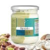 Bronte store jar of pistachio and coconut bigusto cream. With a bed of pistachio on the left and shredded coconut on the right.