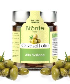 Jar of olives in oil with silver cap and yellow and green label. Several green olives framing.