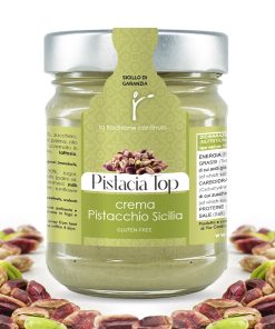 Jar of Bronte store-brand Sicilian pistachio cream 'Pistacia Top'. Several shelled pistachios framing